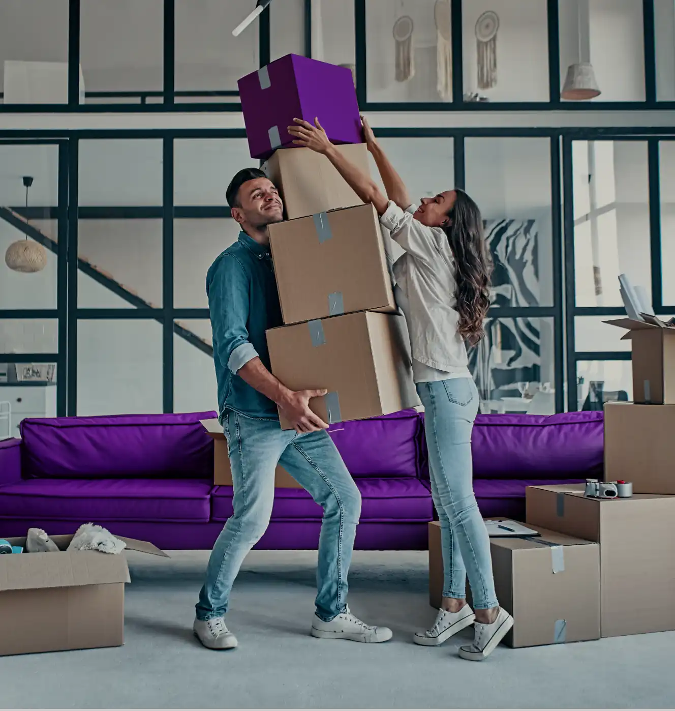 Couple moving boxes from apartment